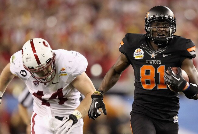 GLENDALE, AZ - JANUARY 02:  Justin Blackmon #81 of the Oklahoma State Cowboys catches a 67-yard touchdown reception in the second quarter against Chase Thomas #44 of the Stanford Cardina during the Tostitos Fiesta Bowl on January 2, 2012 at University of Phoenix Stadium in Glendale, Arizona.(Photo by Christian Petersen/Getty Images)