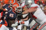 CHAMPAIGN, IL - OCTOBER 15: Whitney Mercilus #85 of the Illinois Fighting Illini rushes against Jack Mewhort #74 of the Ohio State Buckeyes at Memorial Stadium on October 15, 2011 in Champaign, Illinois. Ohio State defeated Illinois 17-7. (Photo by Jonathan Daniel/Getty Images)