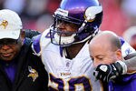 LANDOVER, MD - DECEMBER 24: Running back Adrian Peterson #28 of the Minnesota Vikings is helped off the field after being injured in the third quarter against the Washington Redskins at FedEx Field on December 24, 2011 in Landover, Maryland. (Photo by Patrick Smith/Getty Images)