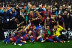 LONDON, ENGLAND - MAY 28:  Lionel Messi (C,L) and Daniel Alves (C,R) of Barcelona hold the trophy as the team pose for photographs after victory in the UEFA Champions League final between FC Barcelona and Manchester United FC at Wembley Stadium on May 28, 2011 in London, England.  (Photo by Laurence Griffiths/Getty Images)