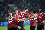 MILAN, ITALY - MARCH 24:  Zlatan Ibrahimovic of Milan celebrates with team-mates after scoring his first goal during the Serie A match between AC Milan and AS Roma at Stadio Giuseppe Meazza on March 24, 2012 in Milan, Italy.  (Photo by Dino Panato/Getty Images)