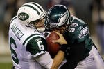 PHILADELPHIA, PA - DECEMBER 18:  Mark Sanchez #6 of the New York Jets is sacked by Jason Babin #93 of the Philadelphia Eagles during the first half at Lincoln Financial Field on December 18, 2011 in Philadelphia, Pennsylvania.  (Photo by Rob Carr/Getty Images)