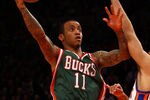 NEW YORK, NY - MARCH 26:  Monta Ellis #11 of the Milwaukee Bucks drives for a shot attempt in the first quarter against the Landry Fields #2 of the New York Knicks at Madison Square Garden on March 26, 2012 in New York City. NOTE TO USER: User expressly acknowledges and agrees that, by downloading and or using this photograph, User is consenting to the terms and conditions of the Getty Images License Agreement.  (Photo by Chris Chambers/Getty Images)