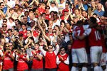 LONDON, ENGLAND - MARCH 24: Fans react after Theo Walcott of Arsenal scores during the Barclays Premier League match between Arsenal and Aston Villal at Emirates Stadium on March 24, 2012 in London, England.  (Photo by Julian Finney/Getty Images)