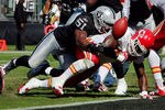OAKLAND, CA - OCTOBER 23:  Fullback Leonard Pope #44 of the Kansas City Chiefs scores a touchdown as the ball pops loose against linebacker Aaron Curry #51 of the Oakland Raiders in the first quarter on October 23, 2011 at O.co Coliseum in Oakland, California.  The Chiefs lead 14-0 in the first half.   (Photo by Brian Bahr/Getty Images)