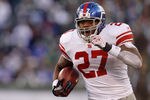 EAST RUTHERFORD, NJ - DECEMBER 24:  Brandon Jacobs #27 of the New York Giants runs for a touchdown against the New York Jets during the second half of a game at MetLife Stadium on December 24, 2011 in East Rutherford. New Jersey. (Photo by Rich Schultz /Getty Images)