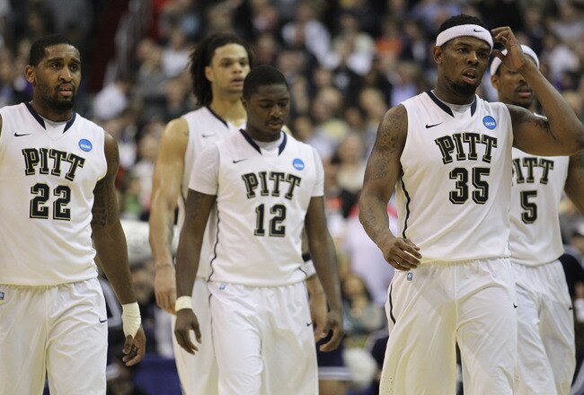 WASHINGTON - MARCH 19:  Members of the Pittsburgh basketball team including Nasir Robinson #35, Ashton Gibbs #12; and Brad Wanamaker#22 walk off the court following their loss against Butler in the third round of the 2011 NCAA men's basketball tournament at Verizon Center on March 19, 2011 in Washington, DC. Butler won the game 71-70.  (Photo by Nick Laham/Getty Images)