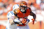 CINCINNATI, OH - OCTOBER 16:  Andre Caldwell #87 of the Cincinnati Bengals runs with the ball while defended by Pat Angerer #51 of the Indianapolis Colts during the NFL game at Paul Brown Stadium on October 16, 2011 in Cincinnati, Ohio. The Bengals won 27-17.  (Photo by Andy Lyons/Getty Images)