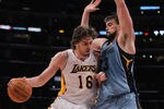 LOS ANGELES, CA - JANUARY 02:  Pau Gasol #16 of the Los Angeles Lakers is defended by Marc Gasol #33 of the Memphis Grizzlies during the second half at Staples Center on January 2, 2011 in Los Angeles, California. The Grizzlies defeated the Lakers 104-85. NOTE TO USER: User expressly acknowledges and agrees that, by downloading and or using this photograph, User is consenting to the terms and conditions of the Getty Images License Agreement.  (Photo by Jeff Gross/Getty Images)