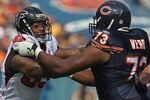 CHICAGO, IL - SEPTEMBER 11:  Ray Edwards #93 of the Atlanta Falcons rushes against J'Marcus Webb #73 of the Chicago Bears at Soldier Field on September 11, 2011 in Chicago, Illinois. The Bears defeated the Falcons 30-12.  (Photo by Jonathan Daniel/Getty Images)