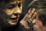 STATE COLLEGE, PA - JANUARY 26: Sue Paterno, widow of Joe Paterno, consoles her grandson following a public memorial for former Penn State Football coach Joe Paterno at the Bryce Jordan Center on the campus of Penn State, January 26, 2012 in State College, Pennsylvania. Paterno, who was 85, died due to complications from lung cancer on January 22, 2012. (Photo by Patrick Smith/Getty Images)