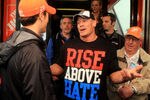 DAYTONA BEACH, FL - FEBRUARY 26:  Joey Logano (L), driver of the #20 The Home Depot Toyota, speaks to professional wrestler John Cena in the garage area prior to the start of the NASCAR Sprint Cup Series Daytona 500 at Daytona International Speedway on February 26, 2012 in Daytona Beach, Florida.  (Photo by Matthew Stockman/Getty Images)