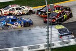 MARTINSVILLE, VA - APRIL 01:  Ryan Newman, driver of the #39 Outback Steak House Chevrolet, steers low to avoid the incident between Clint Bowyer, driver of the #15 5-hour Energy Toyota, Jimmie Johnson, driver of the #48 MyLowe's Chevrolet, , Jeff Gordon, driver of the #24 Drive to End Hunger Chevrolet, and Brad Keselowski, driver of the #2 Miller Lite Dodge, in turn two during the NASCAR Sprint Cup Series Goody's Fast Relief 500 at Martinsville Speedway on April 1, 2012 in Martinsville, Virginia.  (Photo by Jeff Zelevansky/Getty Images)