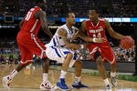 NEW ORLEANS, LA - MARCH 31:  William Buford #44 of the Ohio State Buckeyes drives on Travis Releford #24 of the Kansas Jayhawks in the second half during the National Semifinal game of the 2012 NCAA Division I Men's Basketball Championship at the Mercedes-Benz Superdome on March 31, 2012 in New Orleans, Louisiana.  (Photo by Chris Graythen/Getty Images)