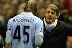 LIVERPOOL, ENGLAND - NOVEMBER 27:  Manchester City Manager Roberto Mancini speaks to Mario Balotelli as he heads for the dressing room after being sent off during the Barclays Premier League match between Liverpool and Manchester City at Anfield on November 27, 2011 in Liverpool, England.  (Photo by Alex Livesey/Getty Images)
