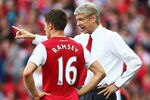LONDON, ENGLAND - SEPTEMBER 10:  Arsene Wenger manager of Arsenal talks to Aaron Ramsey during the Barclays Premier League match between Arsenal and Swansea City at Emirates Stadium on September 10, 2011 in London, England.  (Photo by Clive Mason/Getty Images)