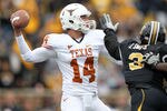 COLUMBIA, MO - NOVEMBER 12:  Quarterback David Ash #14 of the Texas Longhorns passes during the game against the Missouri Tigers on November 12, 2011 at Faurot Field/Memorial Stadium in Columbia, Missouri.  (Photo by Jamie Squire/Getty Images)