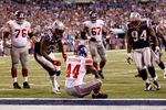 INDIANAPOLIS, IN - FEBRUARY 05:  Ahmad Bradshaw #44 of the New York Giants scores a 6-yard rushing touchdown against Brandon Spikes #55 and Shaun Ellis #94 of the New England Patriots during Super Bowl XLVI at Lucas Oil Stadium on February 5, 2012 in Indianapolis, Indiana. The Giants won 21-17.  (Photo by Rob Carr/Getty Images)
