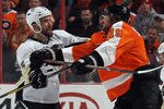 PHILADELPHIA, PA - FEBRUARY 18: Deryk Engelland #5 of the Pittsburgh Penguins hits Scott Hartnell #19 of the Philadelphia Flyers at the Wells Fargo Center on February 18, 2012 in Philadelphia, Pennsylvania.  (Photo by Bruce Bennett/Getty Images)