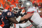 CHAMPAIGN, IL - OCTOBER 15:  Whitney Mercilus #85 of the Illinois Fighting Illini rushes against Jack Mewhort #74 of the Ohio State Buckeyes at Memorial Stadium on October 15, 2011 in Champaign, Illinois. Ohio State defeated Illinois 17-7.  (Photo by Jonathan Daniel/Getty Images)
