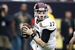 HOUSTON - DECEMBER 31:  Quarterback Ryan Tannehill #17 of Texas A&M Aggies rolls out looking for a receiver against Northwestern Wildcats at Reliant Stadium on December 31, 2011 in Houston, Texas.  (Photo by Bob Levey/Getty Images)