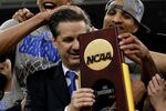 NEW ORLEANS, LA - APRIL 02:  Head coach John Calipari celebrates with his team after the Wildcats defeat the Kansas Jayhawks 67-59 in the National Championship Game of the 2012 NCAA Division I Men's Basketball Tournament at the Mercedes-Benz Superdome on April 2, 2012 in New Orleans, Louisiana.  (Photo by Ronald Martinez/Getty Images)