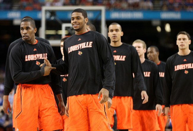 NEW ORLEANS, LA - MARCH 31:  Chris Smith #5 and Chane Behanan #24 of the Louisville Cardinals walk out on the court before taking on the Kentucky Wildcats during the National Semifinal game of the 2012 NCAA Division I Men's Basketball Championship at the Mercedes-Benz Superdome on March 31, 2012 in New Orleans, Louisiana.  (Photo by Chris Graythen/Getty Images)