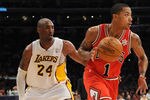LOS ANGELES, CA - DECEMBER 25:  Derrick Rose #1 of the Chicago Bulls drives against Kobe Bryant #24 of the Los Angeles Lakers at Staples Center on December 25, 2011 in Los Angeles, California.  NOTE TO USER: User expressly acknowledges and agrees that, by downloading and or using this photograph, User is consenting to the terms and conditions of the Getty Images License Agreement.  (Photo by Lisa Blumenfeld/Getty Images)