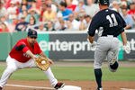 FORT MYERS, FL - MARCH 22:  First baseman Adrian Gonzalez #28 of the Boston Red Sox takes the throw at first as outfielder Brett Gardner #11 of the New York Yankees is out during a Grapefruit League Spring Training Game at JetBlue Park on March 22, 2012 in Fort Myers, Florida.  (Photo by J. Meric/Getty Images)