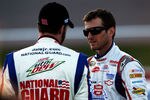 LAS VEGAS, NV - MARCH 09: Dale Earnhardt Jr. (L), driver of the #88 National Guard/Diet Mountain Dew Chevrolet, talks with Kasey Kahne (R), driver of the #5 Farmers Insurance Chevrolet,  during qualifying for the NASCAR Sprint Cup Series Kobalt Tools 400 at Las Vegas Motor Speedway on March 9, 2012 in Las Vegas, Nevada.  (Photo by Tom Pennington/Getty Images)