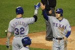 DETROIT, MI - OCTOBER 12:  Ian Kinsler #5 of the Texas Rangers celebrates after scoring on a single by Elvis Andrus #1 with Josh Hamilton #32 in the sixth inning of Game Four of the American League Championship Series against the Detroit Tigers at Comerica Park on October 12, 2011 in Detroit, Michigan.  (Photo by Leon Halip/Getty Images)