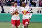 HARRISON, NJ - MARCH 25:  Kenny Cooper #33 and Thierry Henry #14 of the New York Red Bulls celebrate after defeating the Colorado Rapids at Red Bull Arena on March 25, 2012 in Harrison, New Jersey.  (Photo by Mike Lawrie/Getty Images)