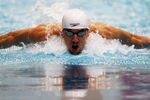 INDIANAPOLIS, IN - MARCH 29: Michael Phelps swims in the men's 100 butterfly finals during day one of the 2012 Indianapolis Grand Prix at the Indiana University Natatorium on March 29, 2012 in Indianapolis, Indiana.  (Photo by Dilip Vishwanat/Getty Images)