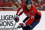 WASHINGTON, DC - MARCH 27: Brooks Laich #21 of the Washington Capitals skates with the puck against the Buffalo Sabres at the Verizon Center on March 27, 2012 in Washington, DC.  (Photo by Rob Carr/Getty Images)