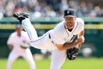 DETROIT, MI - APRIL 05:  Justin Verlander #35 of the Detroit Tigers pitches in the sixth inning on opening day against the Boston Red Sox at Comerica Park on April 5, 2012 in Detroit, Michigan. The Tigers defeated the Red Sox 3-2. (Photo by Leon Halip/Getty Images)