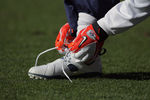 DENVER, CO - JANUARY 01:  A member of the DENVER BRONCOS ties his shoe during warm ups prior to facing the Kansas City Chiefs at Sports Authority Field at Mile High on January 1, 2012 in Denver, Colorado.  (Photo by Doug Pensinger/Getty Images)