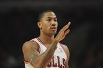 CHICAGO, IL - FEBRUARY 22: Derrick Rose #1 of the Chicago Bulls waves to his family in the stands before a game against the Milwaukee Bucks at the United Center on February 22, 2012 in Chicago, Illinois. The Bulls defeated the Bucks 110-91. NOTE TO USER: User expressly acknowledges and agrees that, by downloading and or using this photograph, User is consenting to the terms and conditions of the Getty Images License Agreement. (Photo by Jonathan Daniel/Getty Images)