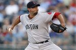 KANSAS CITY, MO - AUGUST 18:  Starting pitcher Josh Beckett #19 of the Boston Red Sox throws in the first inning during a game against the Kansas City Royals at Kauffman Stadium on August 18, 2011 in Kansas City, Missouri. (Photo by Ed Zurga/Getty Images)