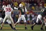 TEMPE, ARIZONA - JANUARY 3:  Quarterback Ken Dorsey #11 the University of Miami Hurricanes throws a pass against the Ohio State Buckeyes during the Tostitos Fiesta Bowl at Sun Devil Stadium on January 3, 2003 in Tempe, Arizona.  Ohio State won the game 31-24 in double-overtime, winning the NCAA National Championship. (Photo by Elsa/Getty Images)
