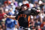 SURPRISE, AZ - MARCH 12:  Starting pitcher Tim Lincecum #55 of the San Francisco Giants pitches against the Kansas City Royals during the spring training game at Surprise Stadium on March 12, 2012 in Surprise, Arizona.  (Photo by Christian Petersen/Getty Images)