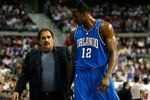 AUBURN HILLS, MI - MAY 13:  Head coach Stan Van Gundy and Dwight Howard #12 of the Orlando Magic walk towards the bench against the Detroit Pistons in Game Five of the Eastern Conference Semifinals during the 2008 NBA Playoffs at the Palace of Auburn Hills in Auburn Hills, Michigan.  NOTE TO USER: User expressly acknowledges and agrees that, by downloading and or using this photograph, User is consenting to the terms and conditions of the Getty Images License Agreement.  (Photo by Gregory Shamus/Getty Images)