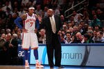 NEW YORK, NY - MARCH 14:  (R) Mike Woodson the interim head coach of the New York Knicks coaches (L) Carmelo Anthony #7 of the New York Knicks  during the game against the Portland Trailblazers at Madison Square Garden on March 14, 2012 in New York City. NOTE TO USER: User expressly acknowledges and agrees that, by downloading and/or using this Photograph, user is consenting to the terms and conditions of the Getty Images License Agreement.  (Photo by Chris Trotman/Getty Images)