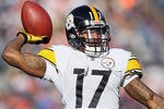 DENVER, CO - JANUARY 08:  Mike Wallace #17 of the Pittsburgh Steelers throws the ball prior to the start of the AFC Wild Card Playoff game against the Denver Broncos at Sports Authority Field at Mile High on January 8, 2012 in Denver, Colorado.  (Photo by Jeff Gross/Getty Images)