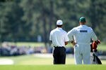 AUGUSTA, GA - APRIL 07:  Tiger Woods of the United States and his caddie Joe LaCava look at a shot on the second hole during the third round of the 2012 Masters Tournament at Augusta National Golf Club on April 7, 2012 in Augusta, Georgia.  (Photo by Jamie Squire/Getty Images)