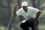 AUGUSTA, GA - APRIL 07:  Tiger Woods of the United States lines up a putt on the third green during the third round of the 2012 Masters Tournament at Augusta National Golf Club on April 7, 2012 in Augusta, Georgia.  (Photo by Jamie Squire/Getty Images)