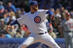CHICAGO, IL - APRIL 05: Starting pitcher Ryan Dempster #46 of the Chicago Cubs delivers the ball against the Washington Nationals during the opening day game at Wrigley Field on April 5, 2012 in Chicago, Illinois.  (Photo by Jonathan Daniel/Getty Images)