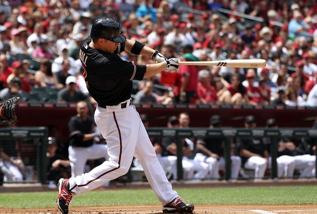 PHOENIX, AZ - APRIL 07:  Aaron Hill #2 of the Arizona Diamondbacks hits a solo home run against the San Francisco Giants during the first inning of the MLB game at Chase Field on April 7, 2012 in Phoenix, Arizona.  (Photo by Christian Petersen/Getty Images)