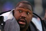 OAKLAND, CA - DECEMBER 17:  Warren Sapp #99 of the Oakland Raiders talks with teammates on the sidelines toward the end of the NFL game against the St. Louis Rams at McAfee Coliseum December 17, 2006 in Oakland, California.  (Photo by Jed Jacobsohn/Getty Images)