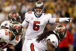 NEW ORLEANS, LA - NOVEMBER 06:   Josh Freeman #5 of the Tampa Bay Buccaneers calls a play during their game against the New Orleans Saints at Mercedes-Benz Superdome on November 6, 2011 in New Orleans, Louisiana.  (Photo by Streeter Lecka/Getty Images)