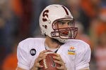 GLENDALE, AZ - JANUARY 02:  Andrew Luck #12 of the Stanford Cardinal looks to pass against the Oklahoma State Cowboys during the Tostitos Fiesta Bowl on January 2, 2012 at University of Phoenix Stadium in Glendale, Arizona. Oklahoma State won 41-38 in overtime.  (Photo by Doug Pensinger/Getty Images)